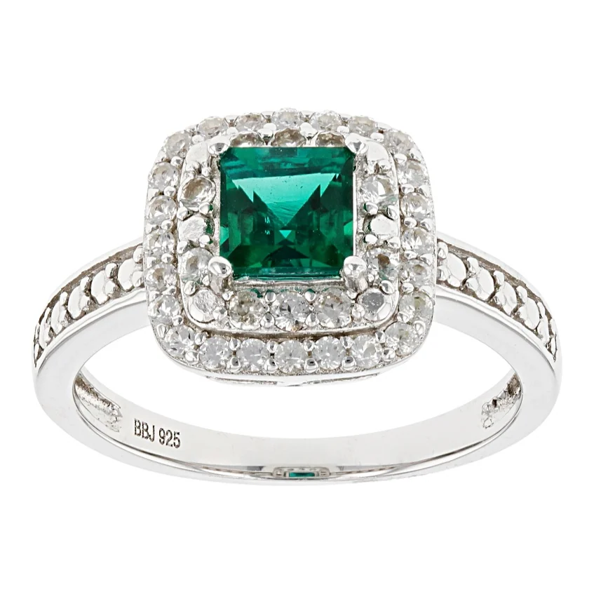 Emerald halo ring in white gold